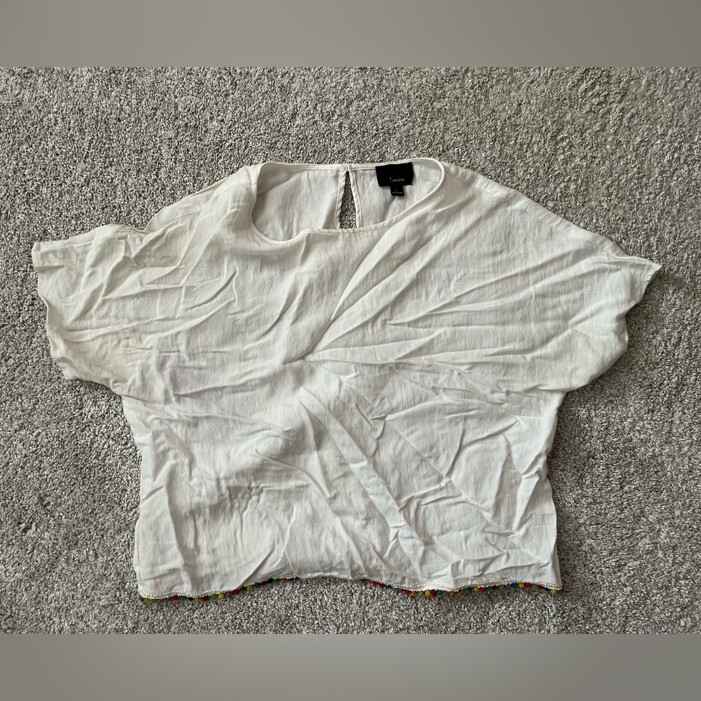 Cropped linen shirt with pompoms